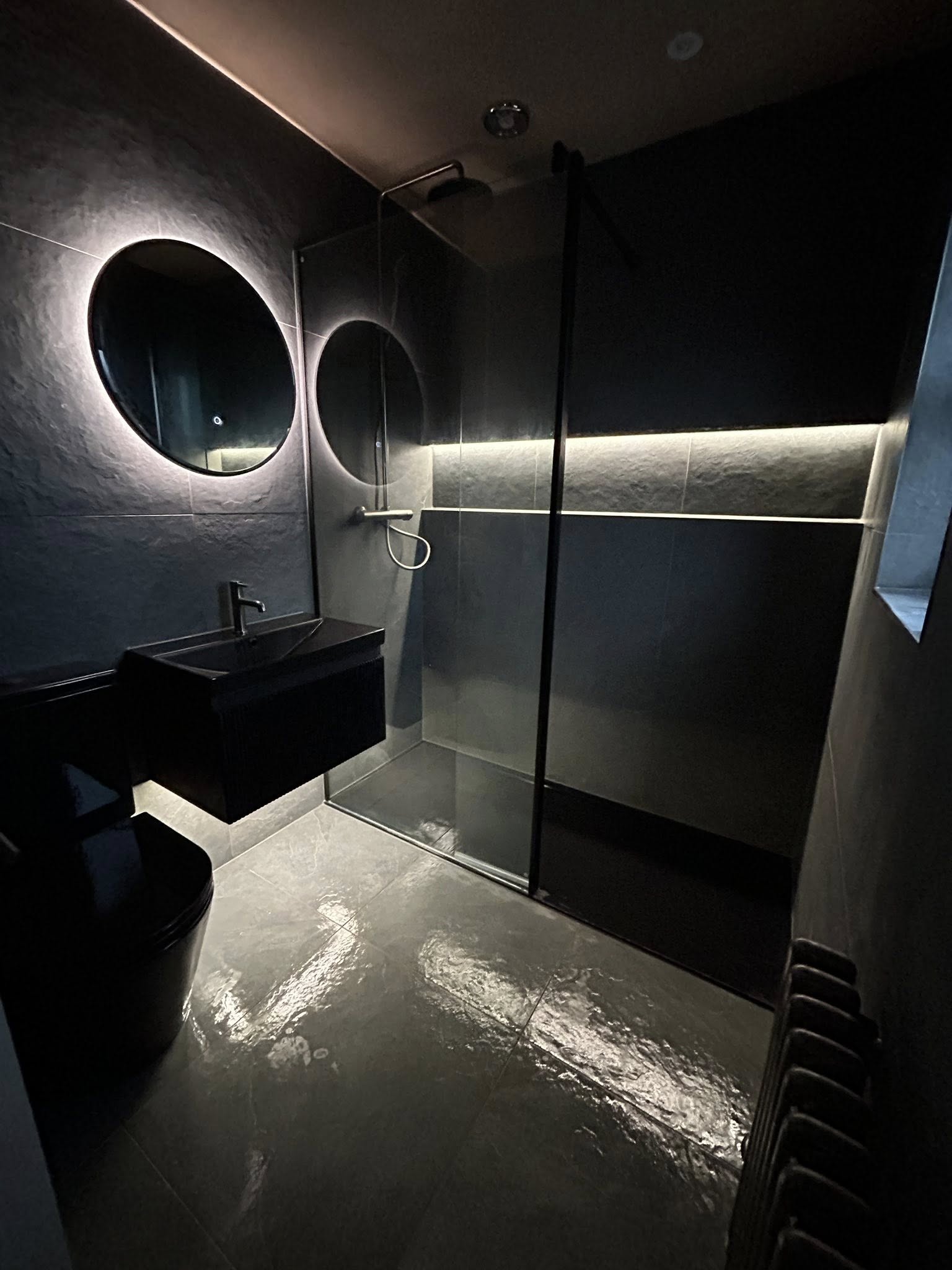 Venetian plaster bathroom with walk-in shower and brass tapware