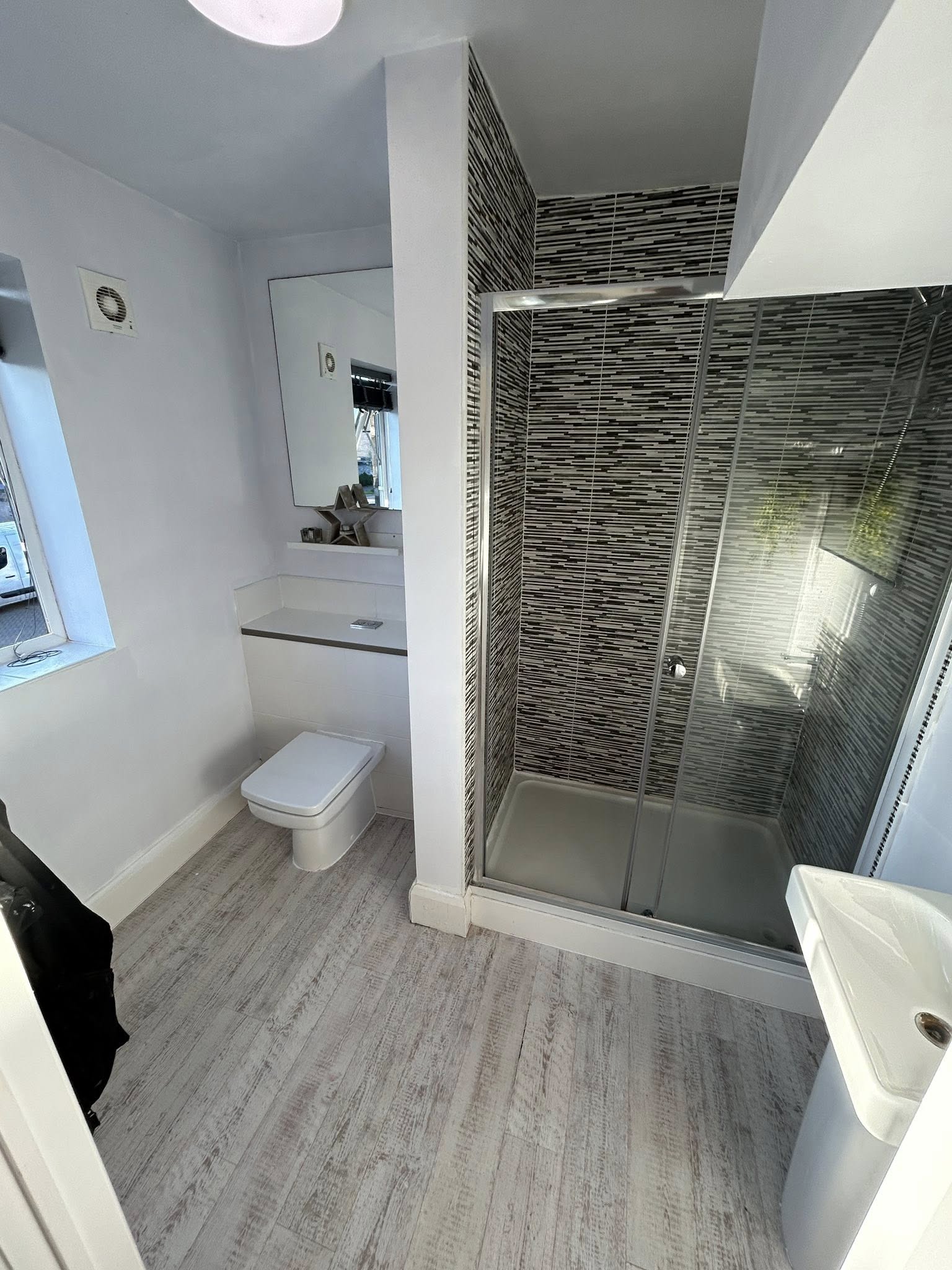 Plumbworks owner on site in a finished bathroom