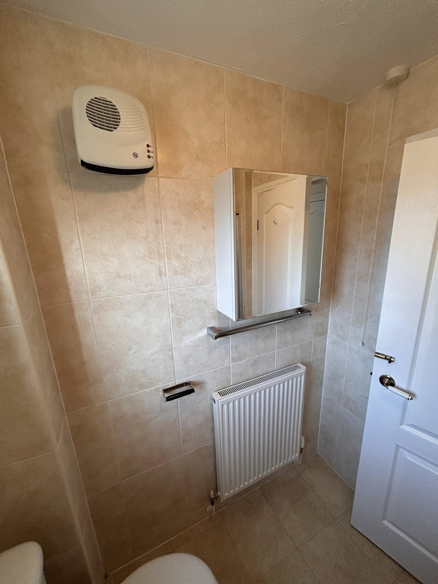 Luxe grey wetroom with brushed gold fittings and backlit mirror